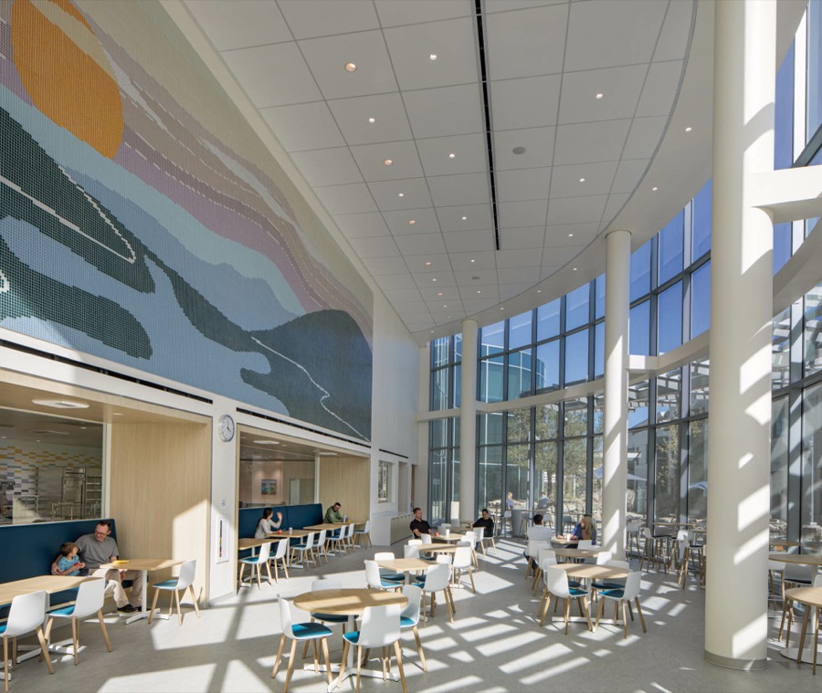Café with mosaic mural and full-height glazing